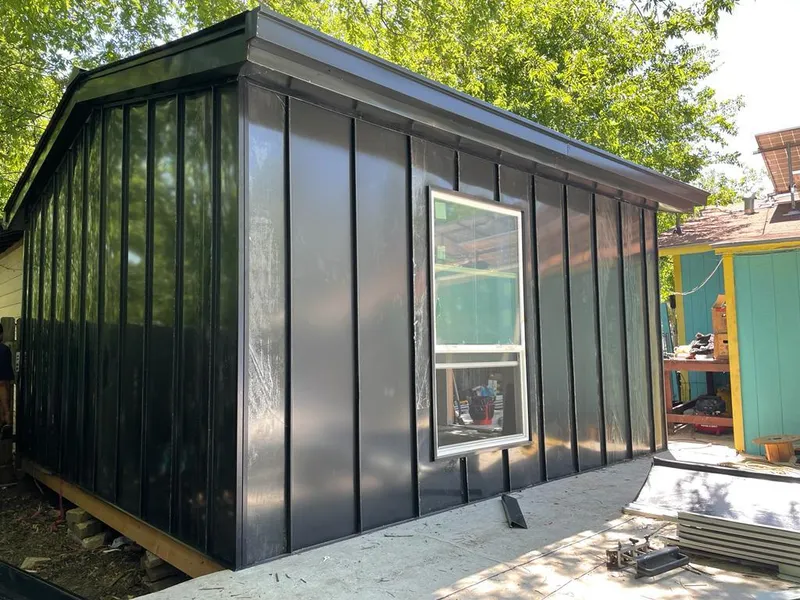 Black standing seam metal wall panels for Metal Roof Installation in Champion Heights