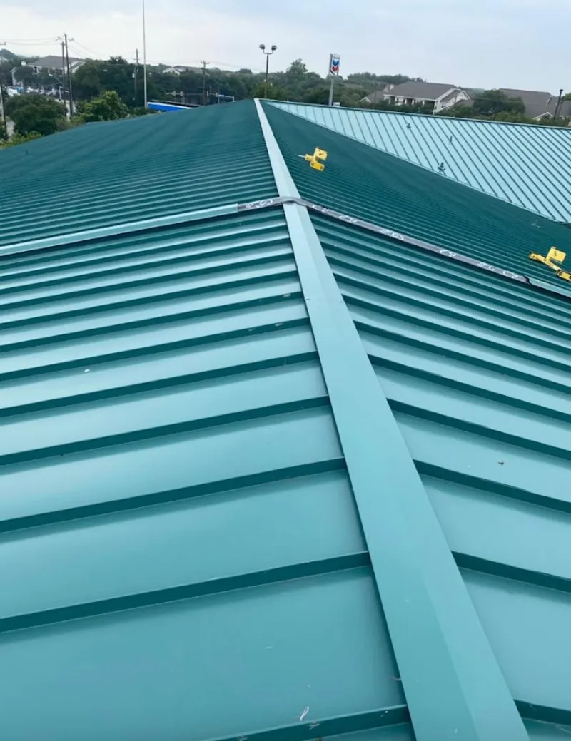 Green commercial metal roof ridge and valley for Metal Roof Repair in Champion Heights